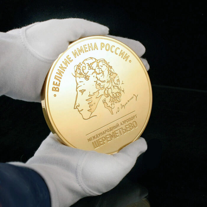 Corporate medal on an acrylic stand